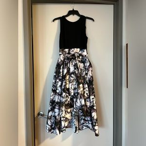 SLNY party dress. Black fitted top w black , white floral skirt and tie waist.